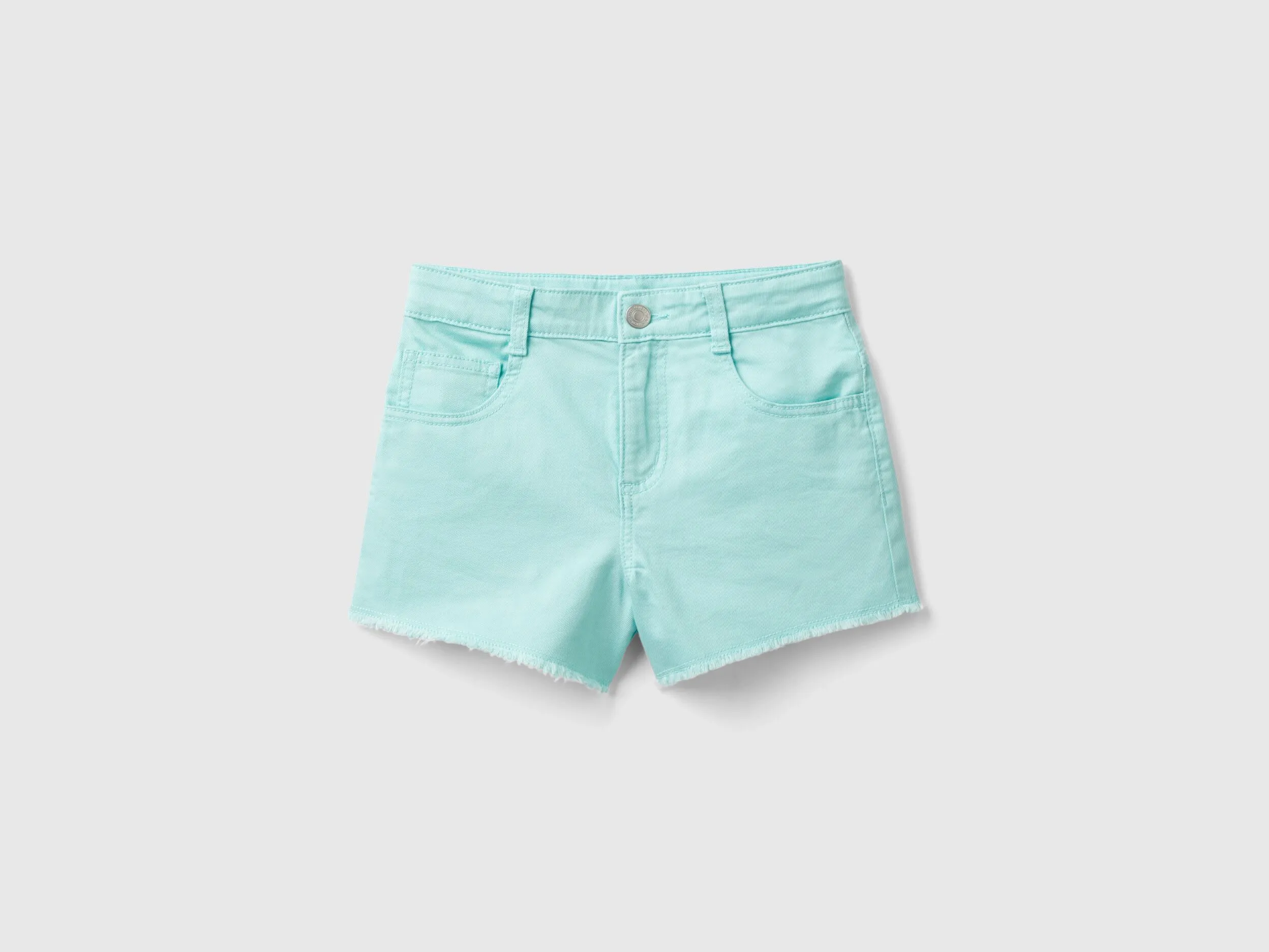 Shorts deshilachados de algodón elástico