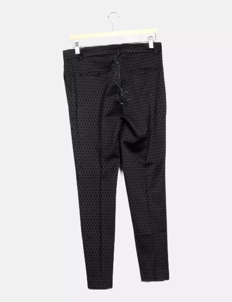 Uterqüe Pantalón negro estampado